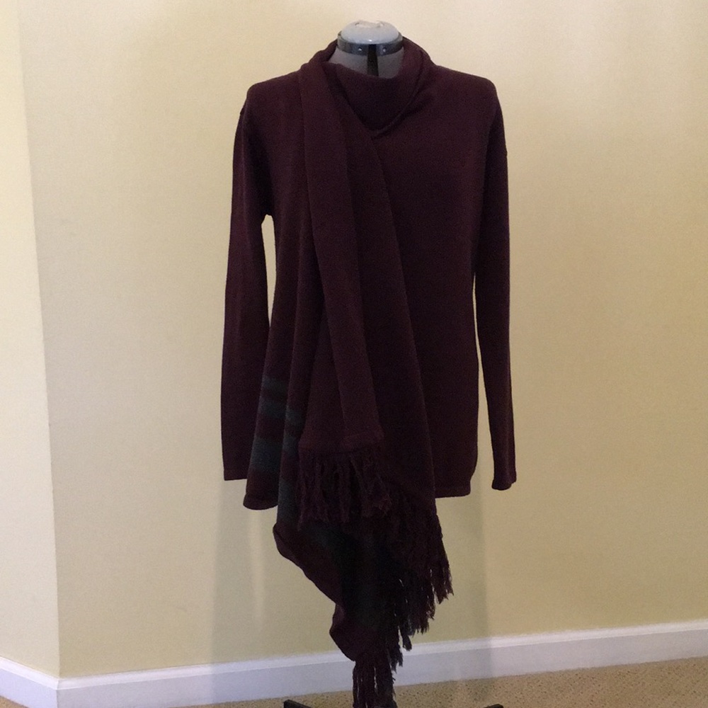 CAbi Sweater-Medium but runs large.  Fits L and XL